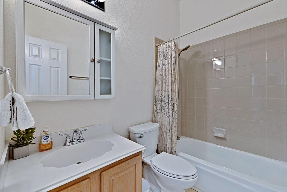 18 Equestrian Court Mansfield, TX 76063 - Photo 17 of 28 a bathroom with a sink toilet and shower