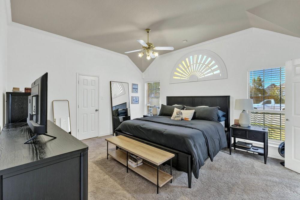 18 Equestrian Court Mansfield, TX 76063 - Photo 18 of 28 a bedroom with a bed and a chandelier