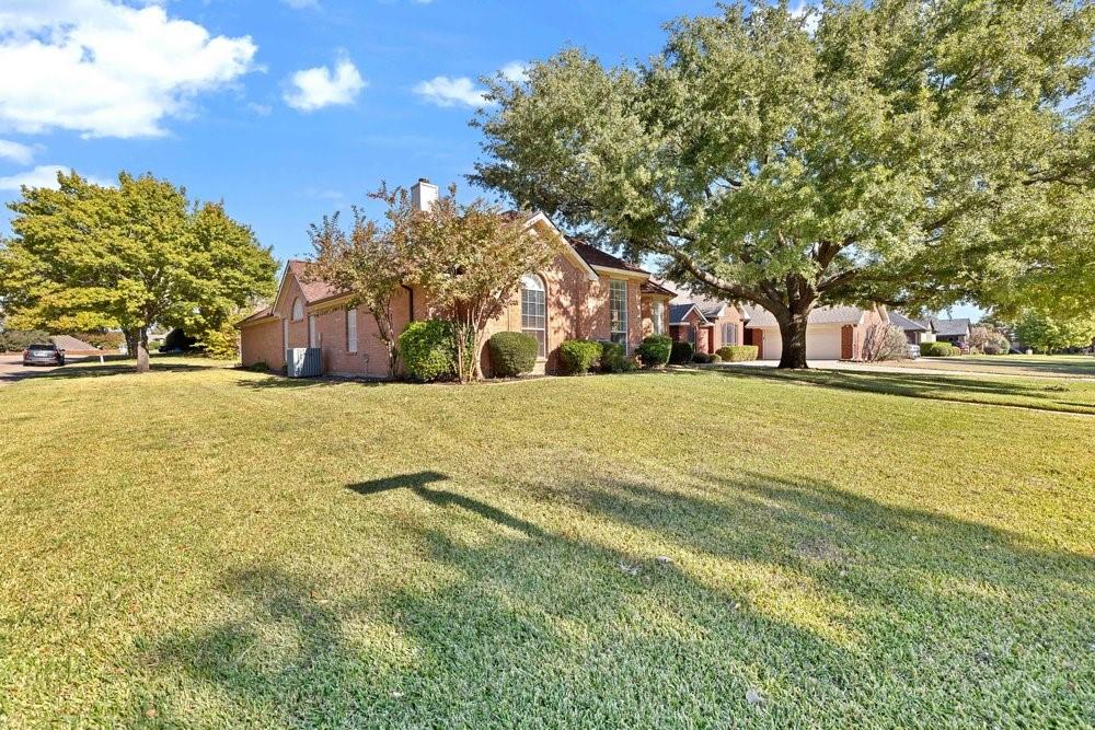 18 Equestrian Court Mansfield, TX 76063 - Photo 2 of 28 a view of a field with trees in front of it