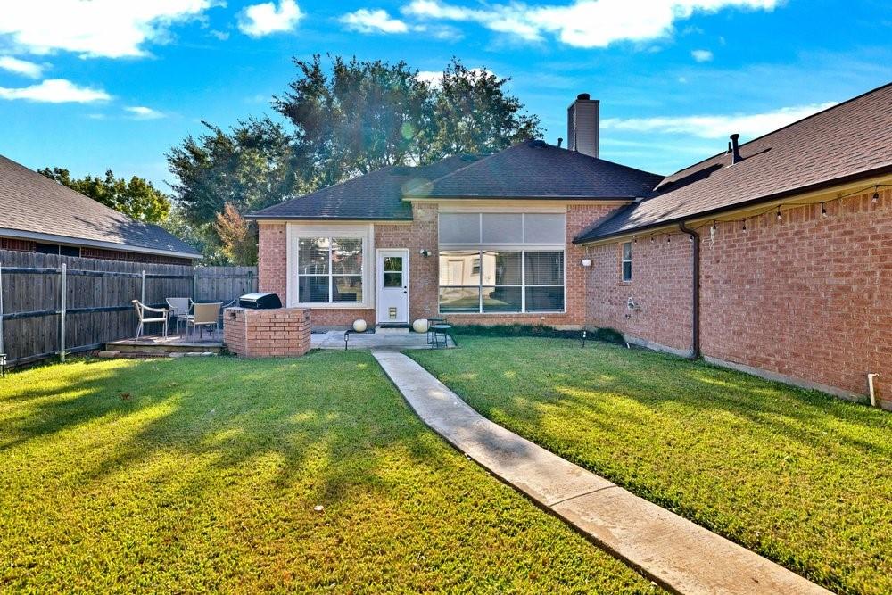18 Equestrian Court Mansfield, TX 76063 - Photo 25 of 28 a view of a house with a backyard
