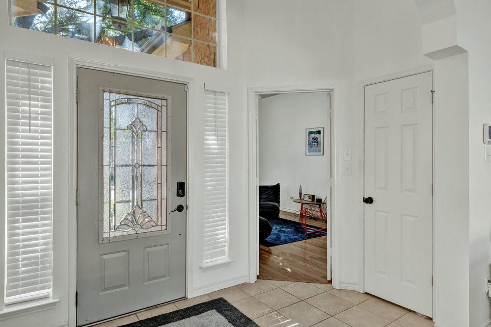 18 Equestrian Court Mansfield, TX 76063 - Photo 3 of 28 a view of a hallway with wooden floor and closet area