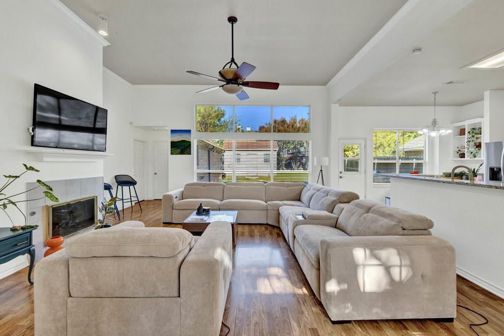 18 Equestrian Court Mansfield, TX 76063 - Photo 5 of 28 a living room with furniture a flat screen tv and a window