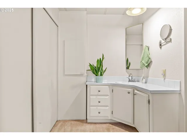 a bathroom with a double vanity sink and mirror