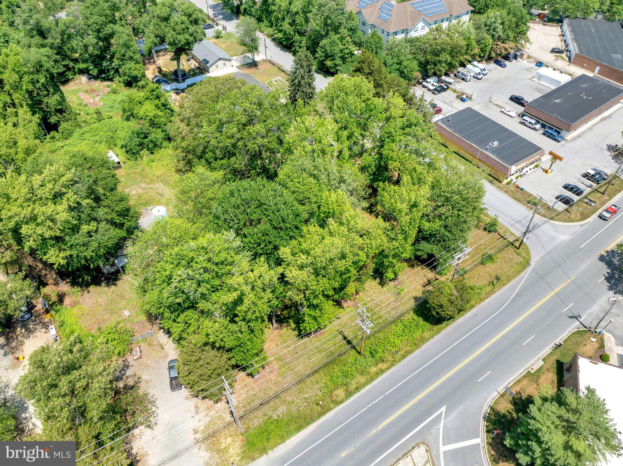 3424-3422 Pike Ridge Road Edgewater, MD 21037 - Photo 3 of 17 an aerial view of residential house with outdoor space and trees all around