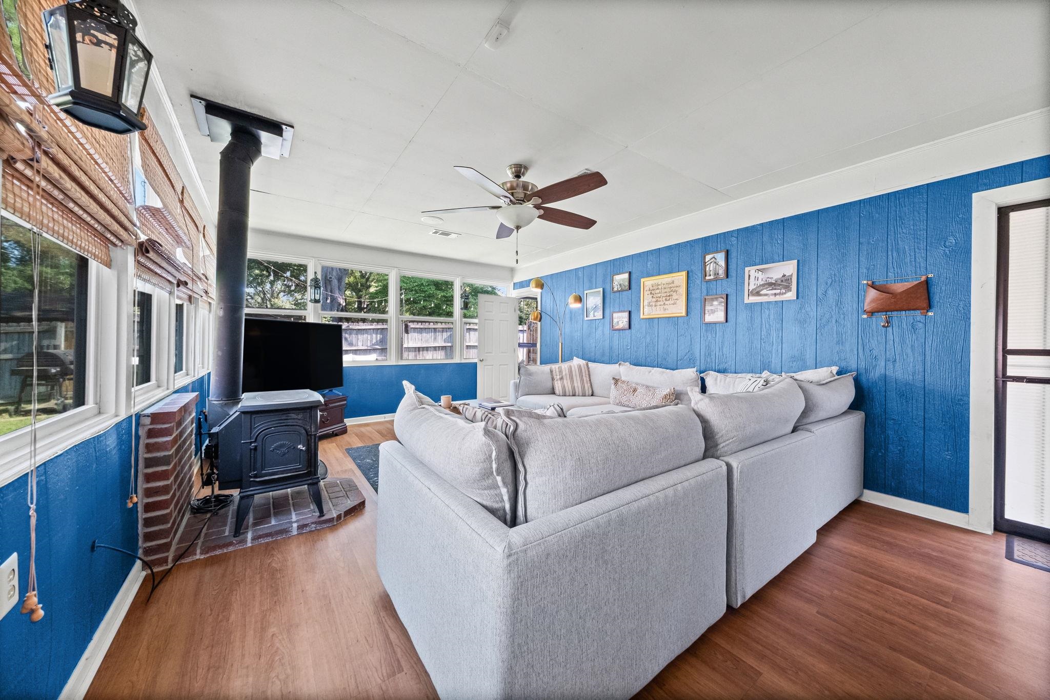 446 Rosser Road Memphis, TN 38120 - Photo 5 of 30 a living room with furniture fireplace and a flat screen tv