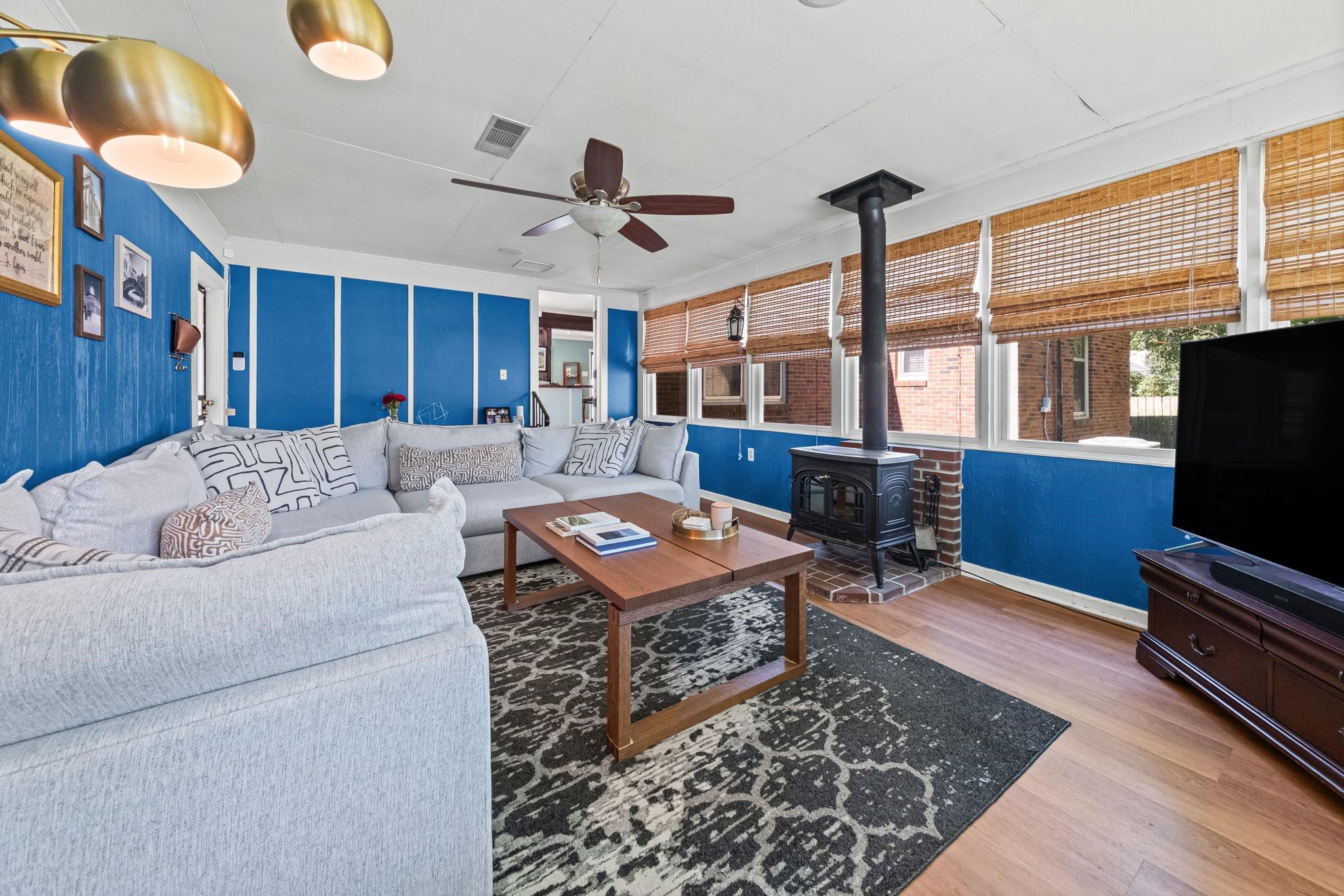 446 Rosser Road Memphis, TN 38120 - Photo 6 of 30 a living room with a couch and a flat screen tv