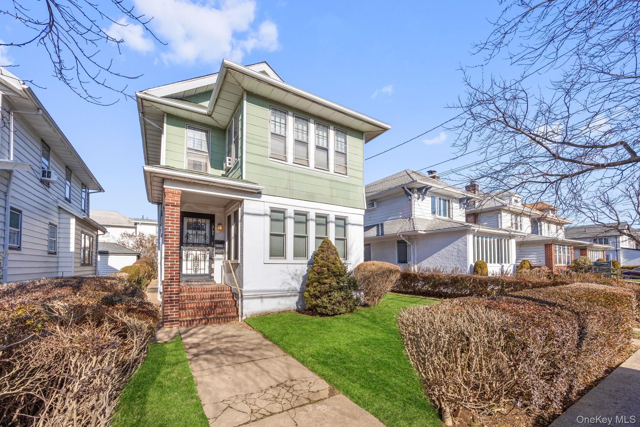 2109 Avenue R Brooklyn, NY 11229 - Photo 2 of 24 a front view of a house with garden