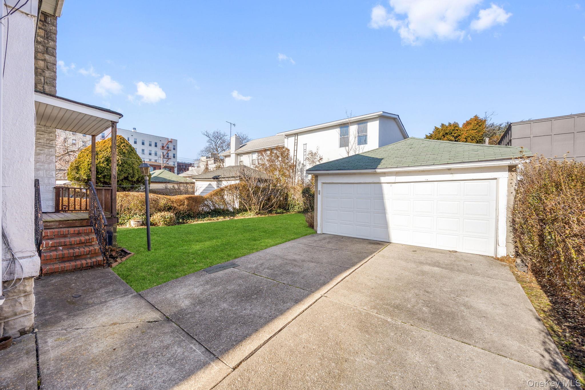 2109 Avenue R Brooklyn, NY 11229 - Photo 5 of 24 a view of a house with a yard and garage