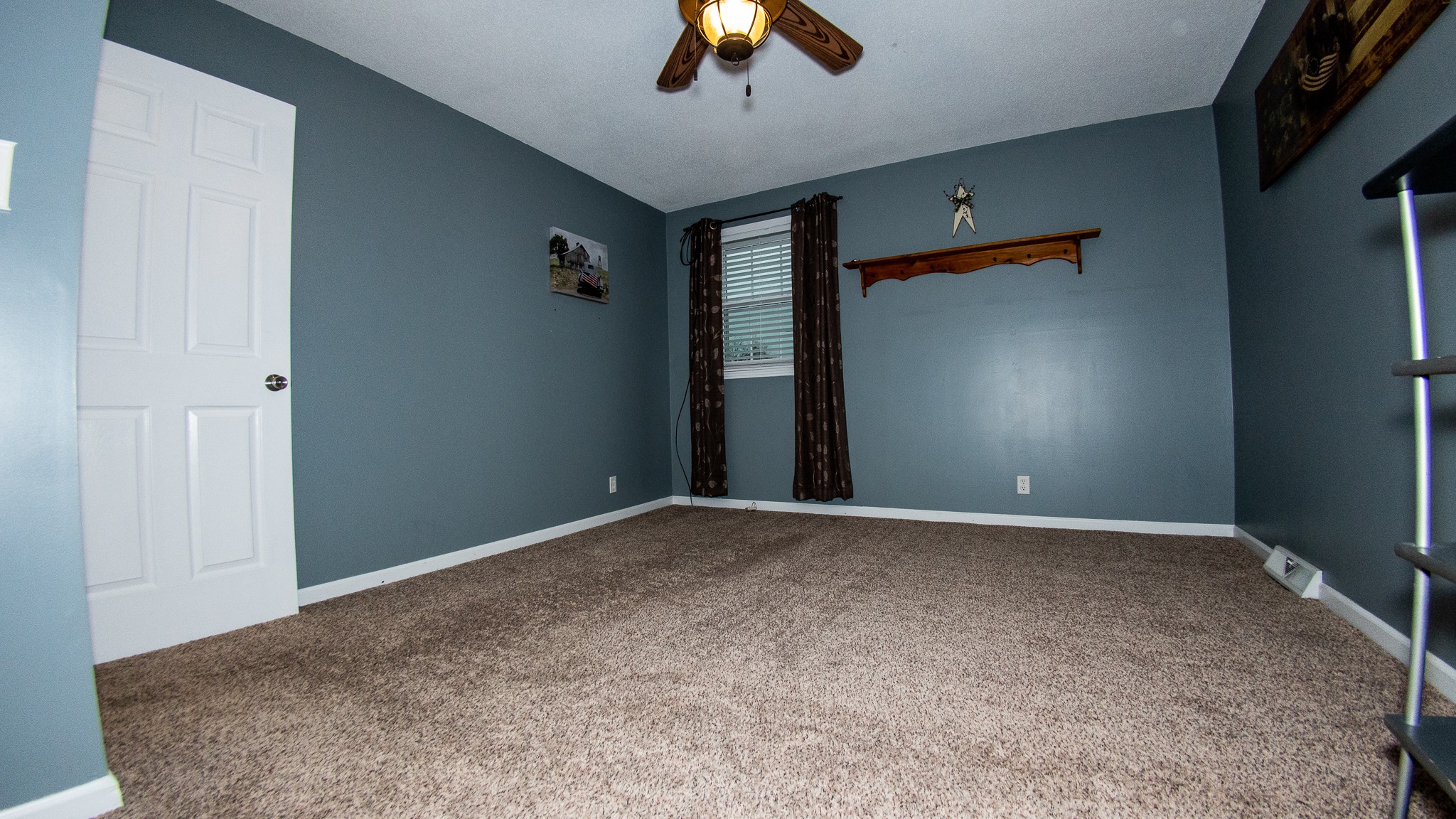 3411 Drake Road Adams, TN 37010 - Photo 17 of 27 a view of an empty room and chandelier fan