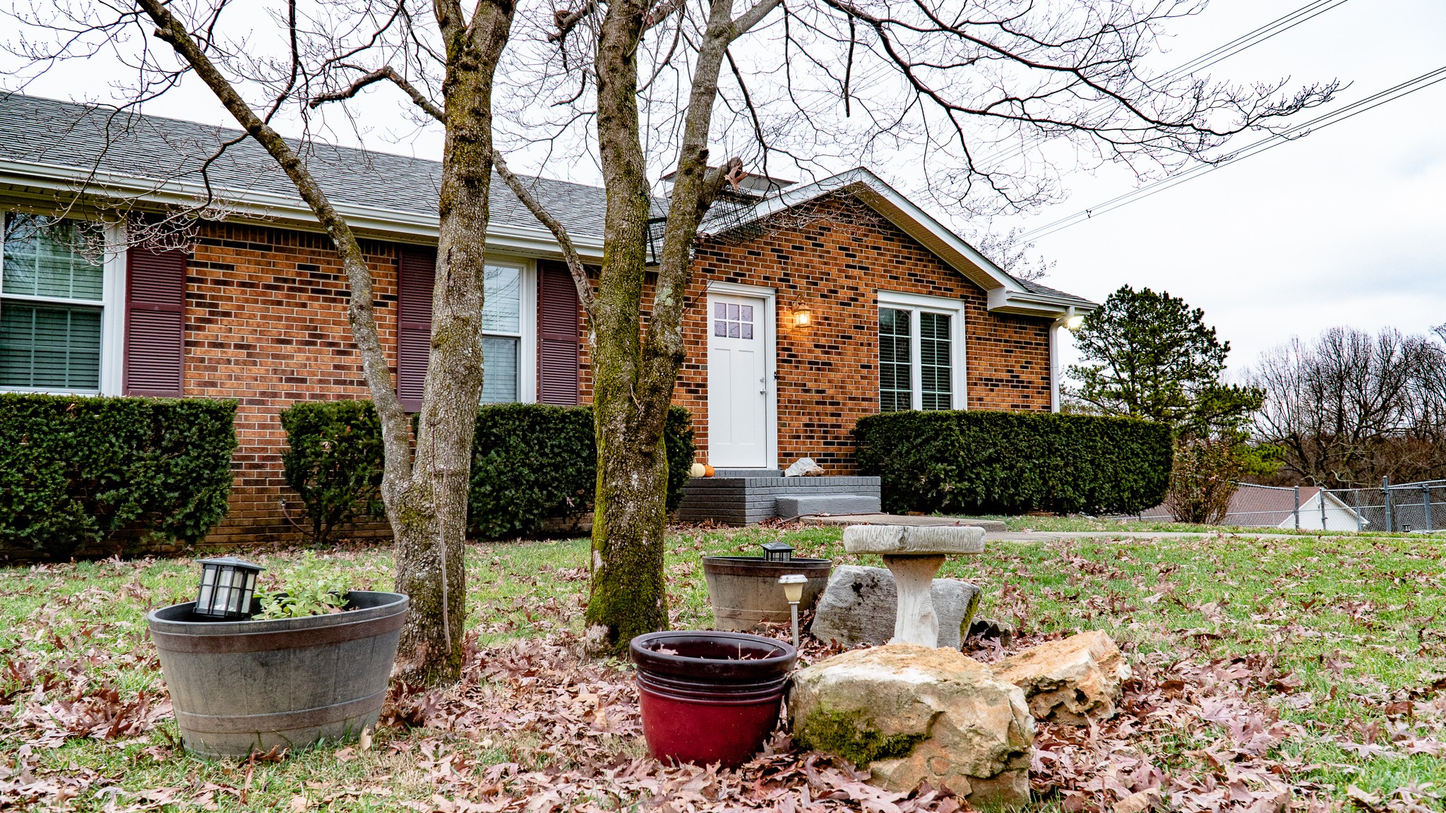 3411 Drake Road Adams, TN 37010 - Photo 7 of 27 a front view of a house with fountain and outdoor seating