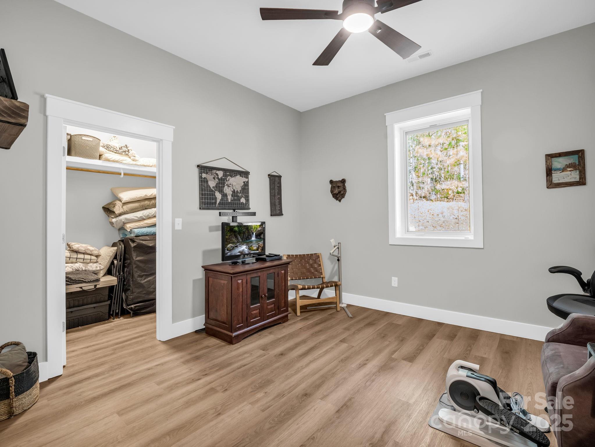 21 Walker Ridge Road Mill Spring, NC 28756 - Photo 28 of 48 a living room with furniture and a wooden floor