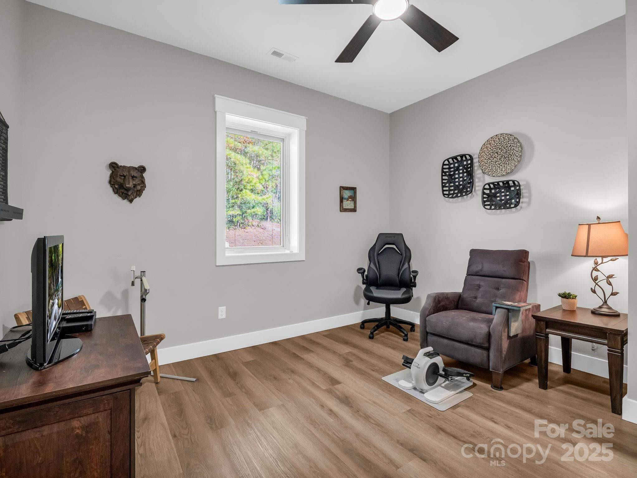 21 Walker Ridge Road Mill Spring, NC 28756 - Photo 29 of 48 a living room with furniture and a window