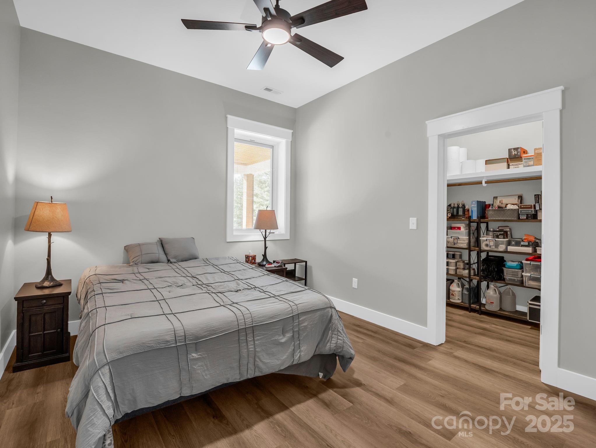 21 Walker Ridge Road Mill Spring, NC 28756 - Photo 32 of 48 a bedroom with a bed and window