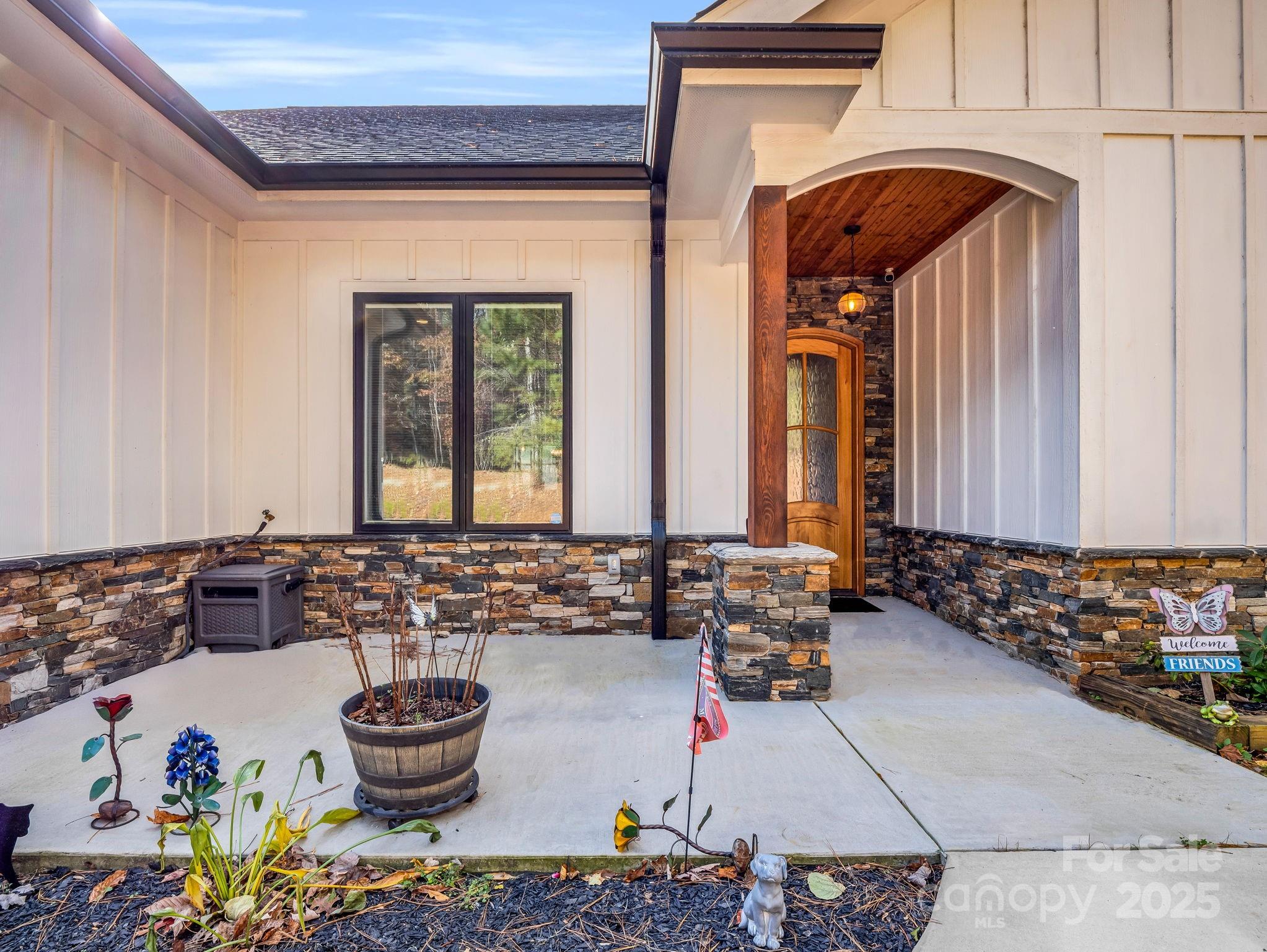 21 Walker Ridge Road Mill Spring, NC 28756 - Photo 40 of 48 a front view of a house with dining table and chairs