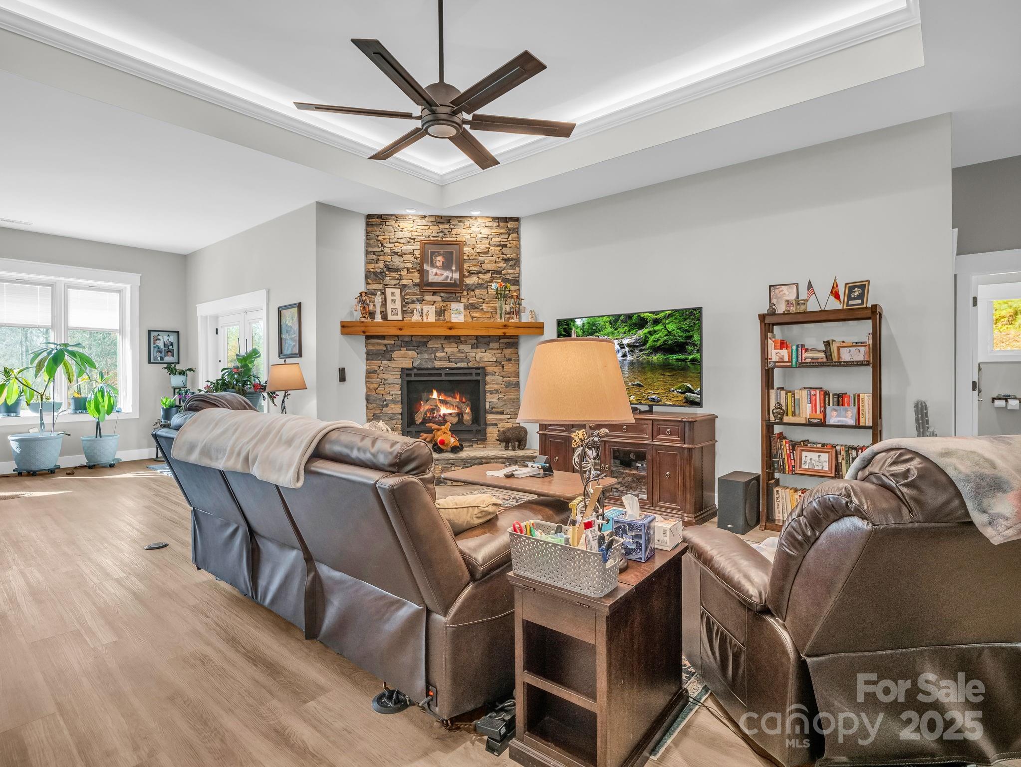 21 Walker Ridge Road Mill Spring, NC 28756 - Photo 6 of 48 a living room with furniture a fireplace and a flat screen tv