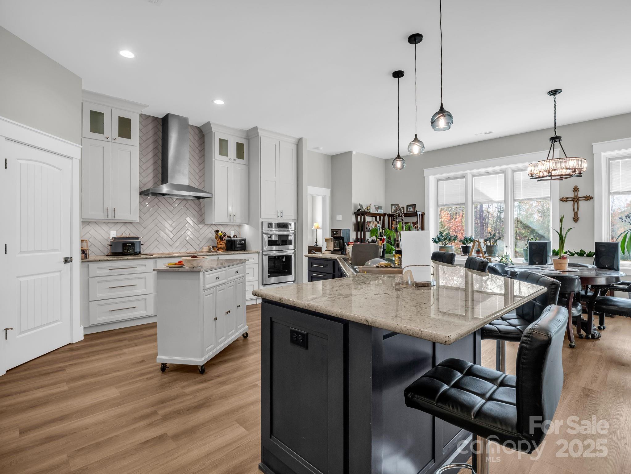 21 Walker Ridge Road Mill Spring, NC 28756 - Photo 8 of 48 a kitchen with counter space appliances and a chair