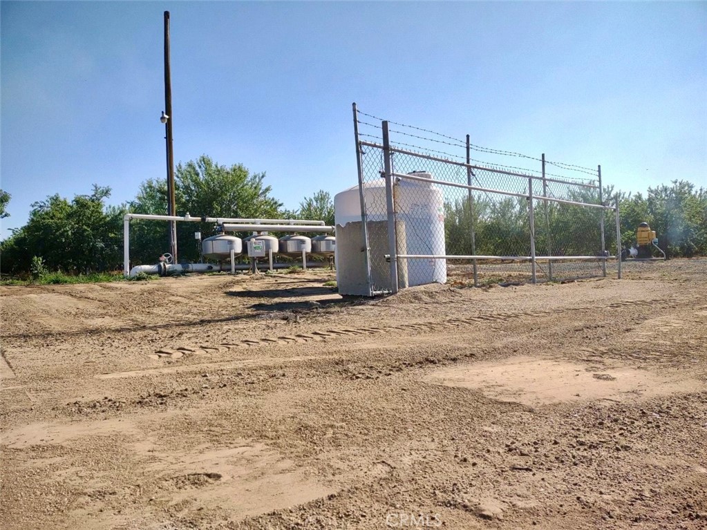 10351 Ave 112 Pixley, CA 93256 - Photo 13 of 14 a view of a dry yard with wooden fence