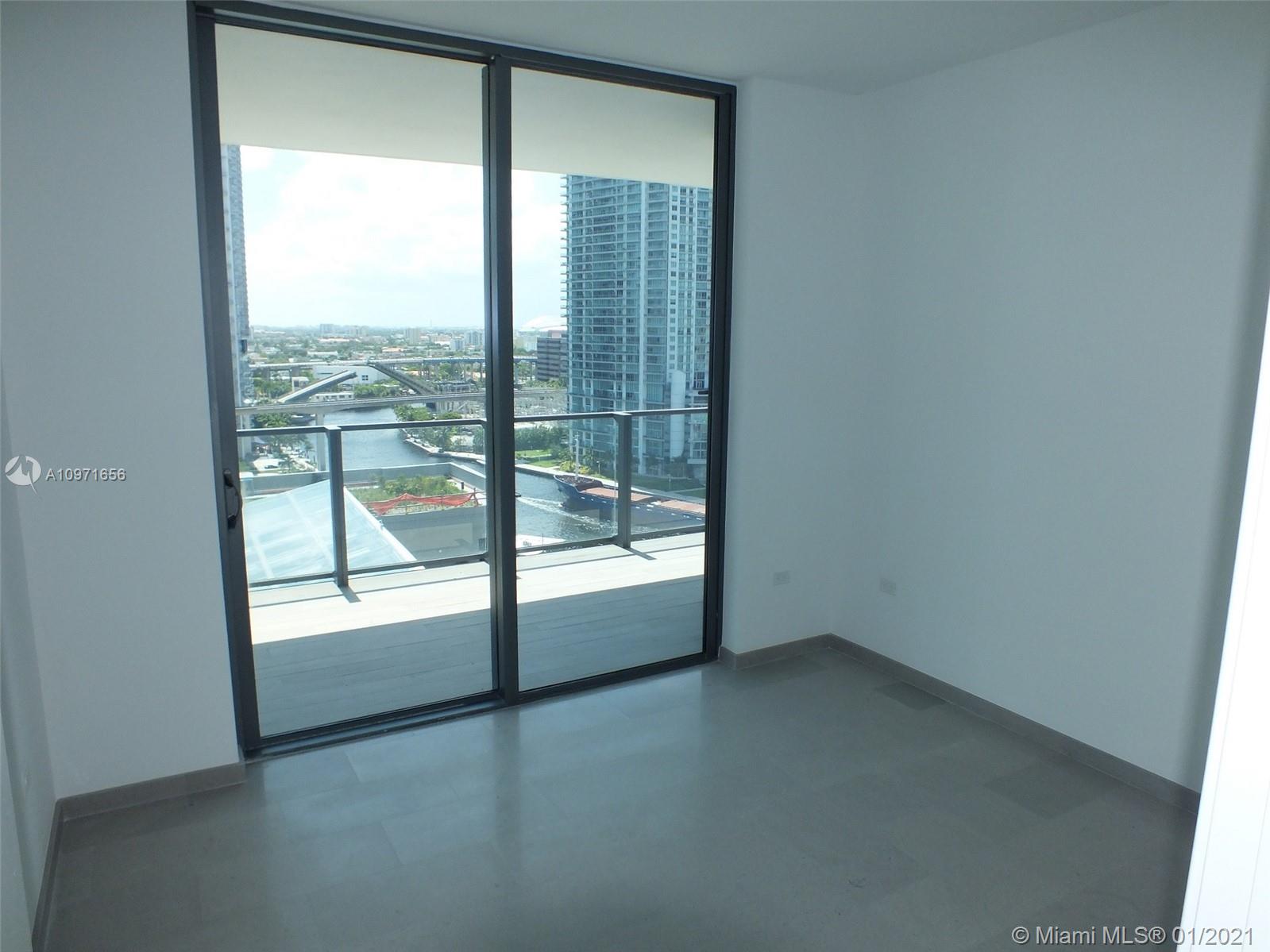 68 Southeast 6th Street, Unit 1010 Miami, FL 33131 - Photo 11 of 43 an empty room with a window