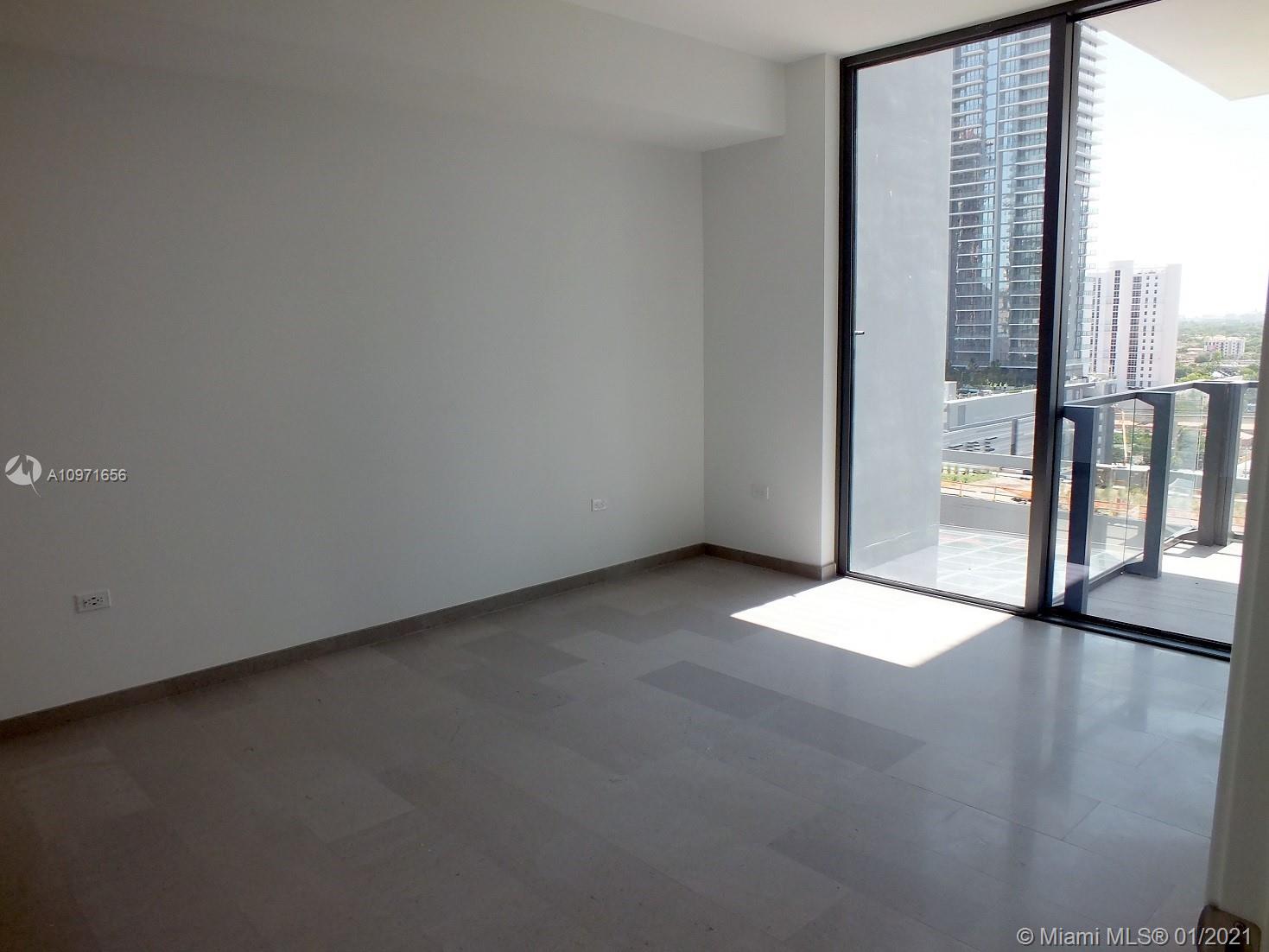 68 Southeast 6th Street, Unit 1010 Miami, FL 33131 - Photo 12 of 43 a view of an empty room with a window