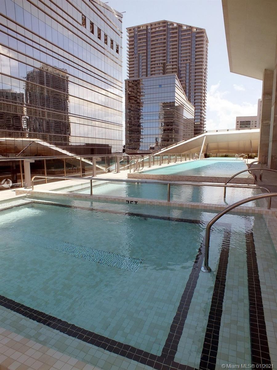 68 Southeast 6th Street, Unit 1010 Miami, FL 33131 - Photo 32 of 43 a view of swimming pool with outdoor seating