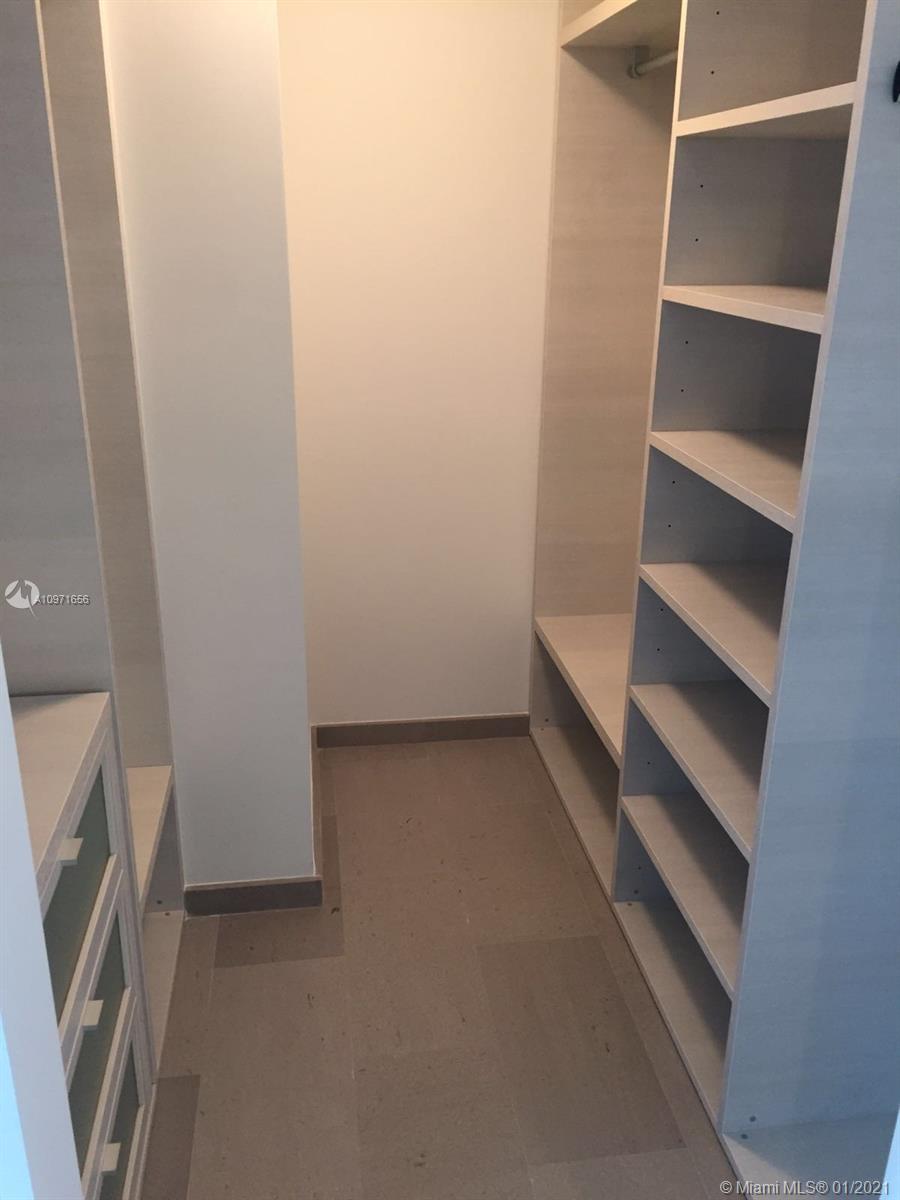 68 Southeast 6th Street, Unit 1010 Miami, FL 33131 - Photo 39 of 43 a view of an empty walk in closet