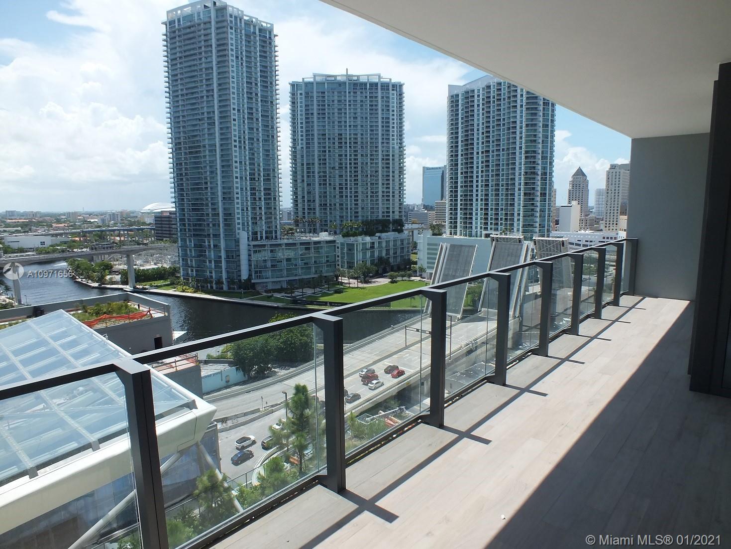 68 Southeast 6th Street, Unit 1010 Miami, FL 33131 - Photo 8 of 43 a city view from a balcony