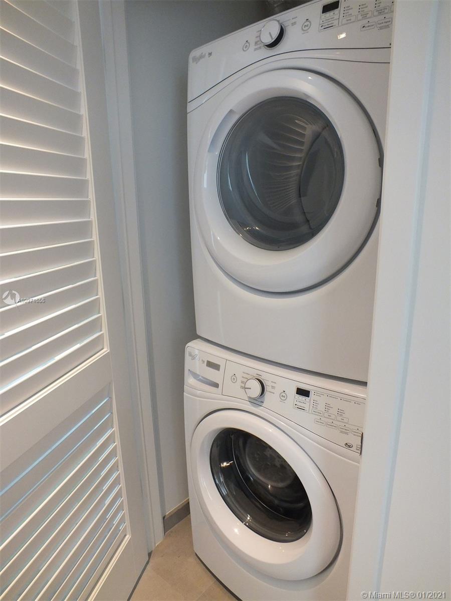 68 Southeast 6th Street, Unit 1010 Miami, FL 33131 - Photo 10 of 43 a utility room with dryer and washer