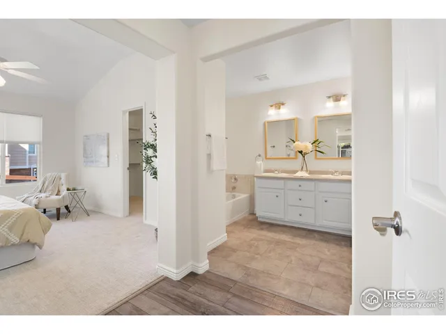 a bedroom with a bed and a view of kitchen
