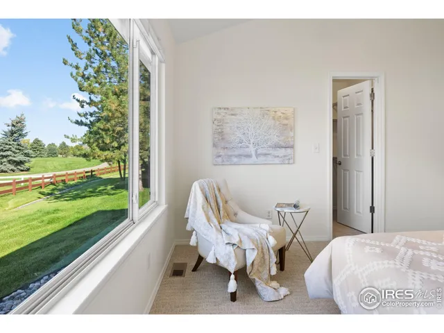 a living room with furniture and a yard