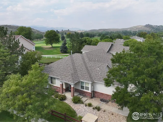 a aerial view of a house with a yard and a garage