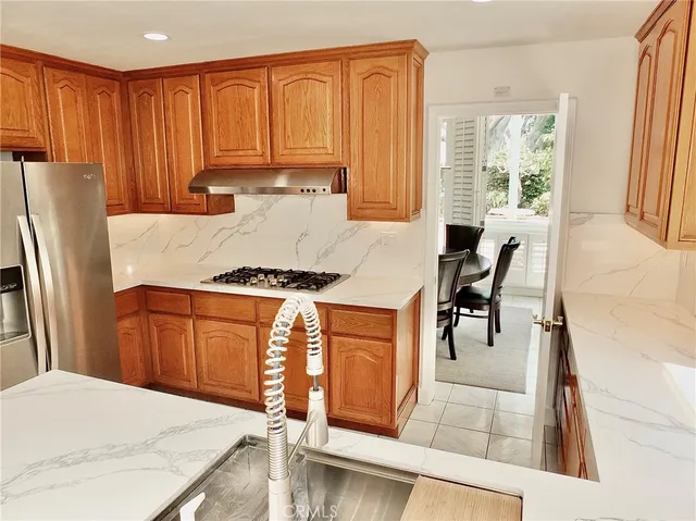 a bathroom with a sink mirror and toilet