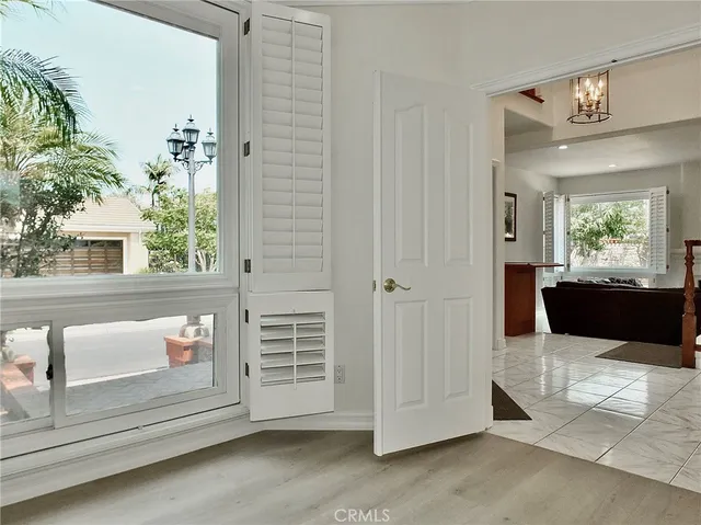 a view of a patio with table and chairs potted plants