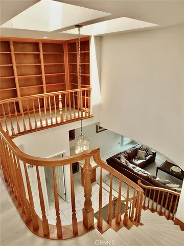 a bathroom with a granite countertop sink toilet a mirror and shower