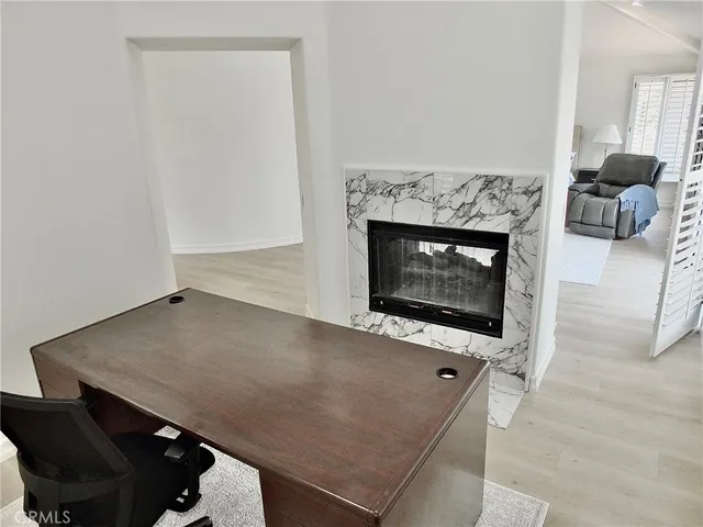 a front view of a building with sitting area