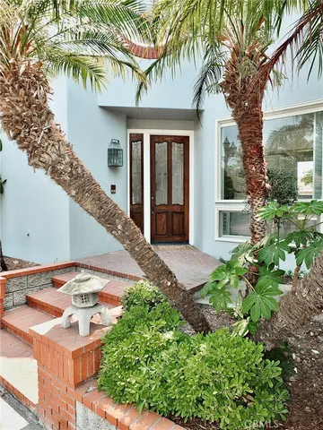 a sign that is in front of flowers