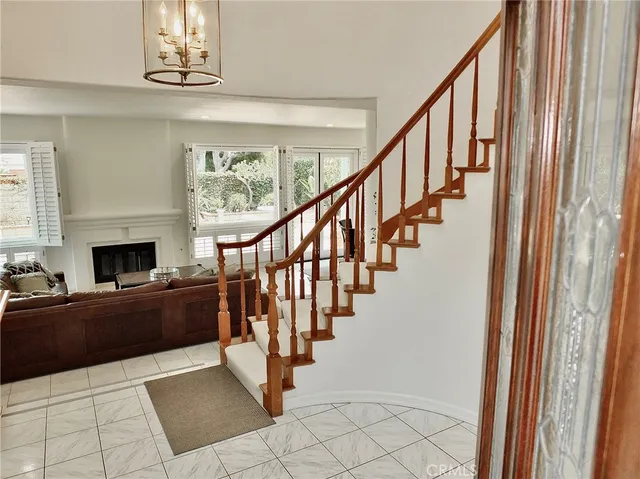 a view of living room kitchen with furniture and lots of windows