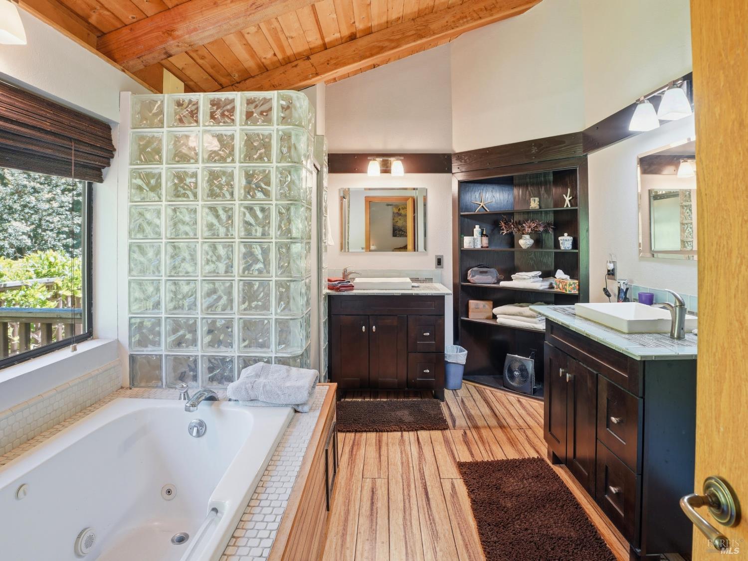 31397 Seaview Road Cazadero, CA 95421 - Photo 24 of 47 a spacious bathroom with a tub sink and mirror
