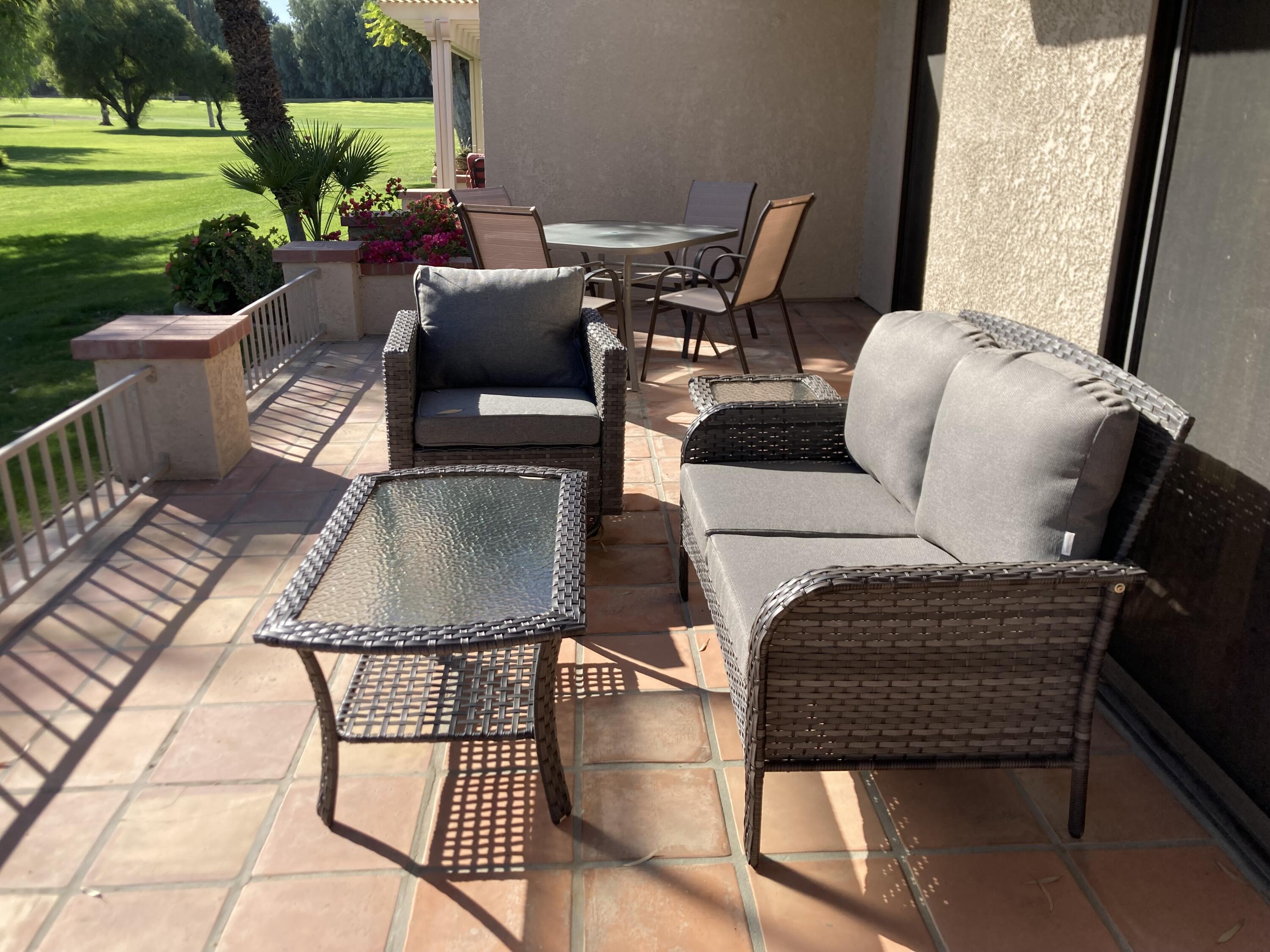 40553 Pebble Beach Circle Palm Desert, CA 92211 - Photo 15 of 22 a view of balcony with furniture and garden