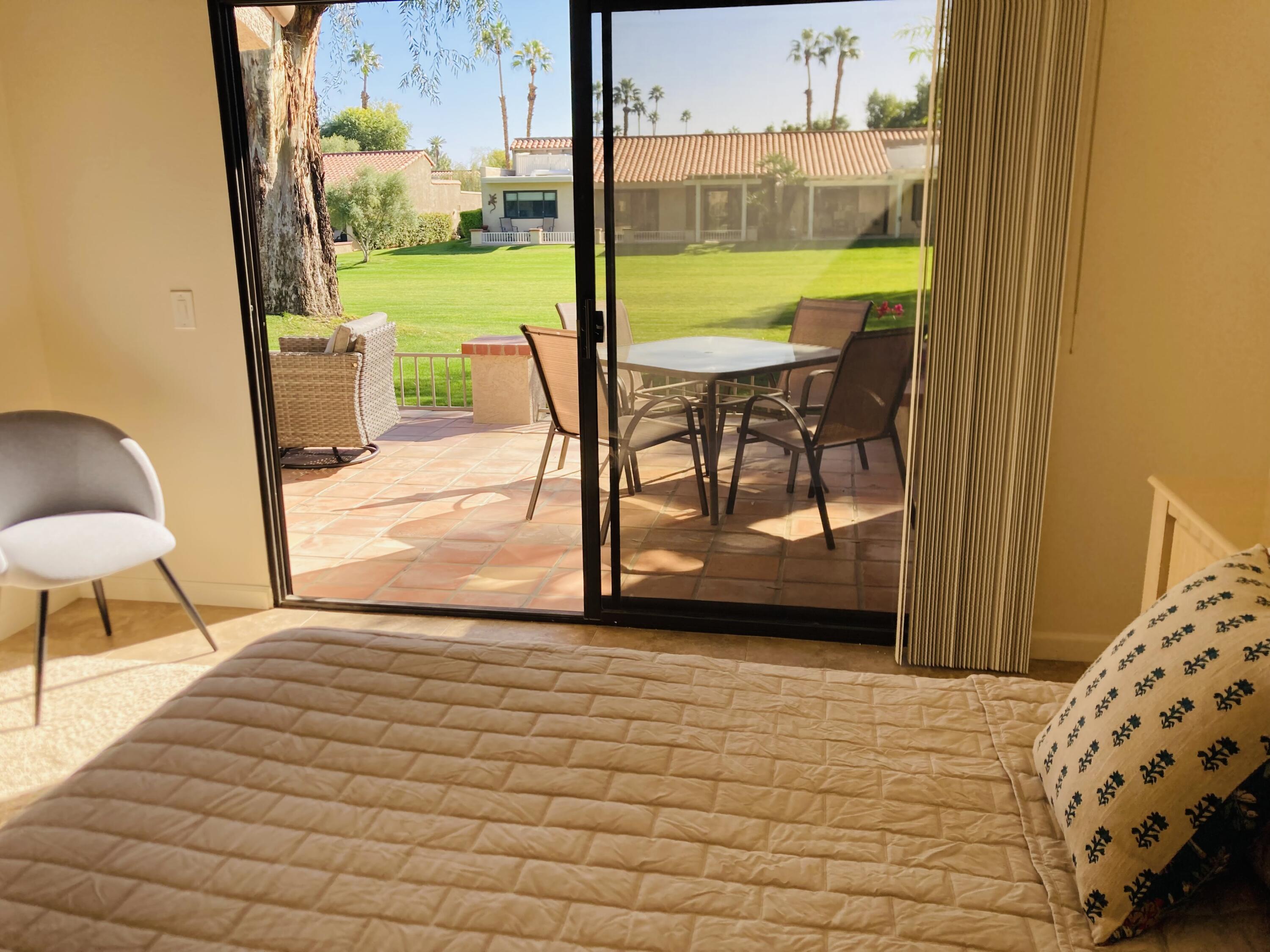 40553 Pebble Beach Circle Palm Desert, CA 92211 - Photo 16 of 22 a view of a swimming pool and an outdoor space