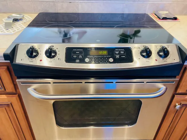 a kitchen with a sink a microwave and cabinets