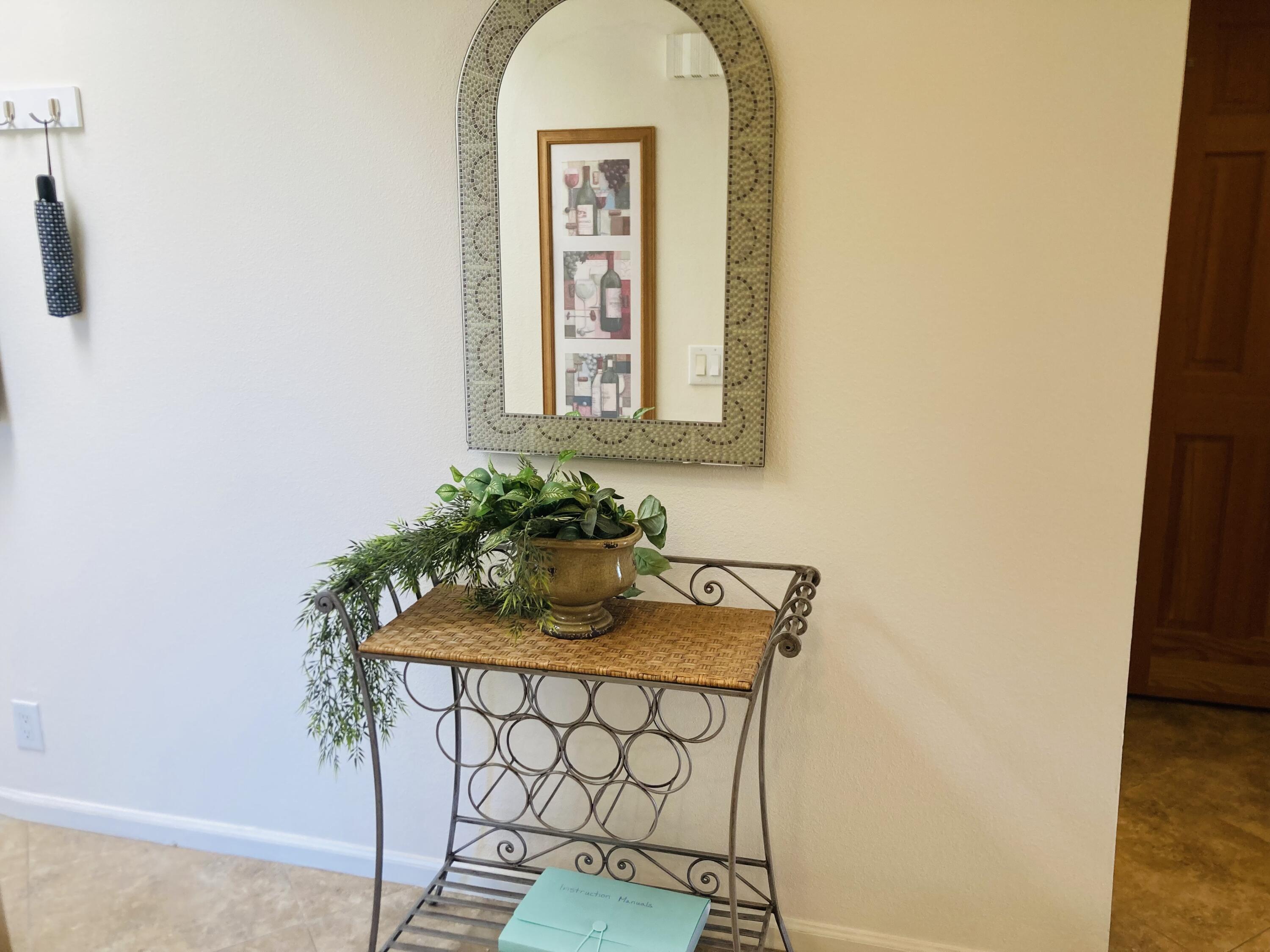 40553 Pebble Beach Circle Palm Desert, CA 92211 - Photo 22 of 22 a view of a door and chair in the room
