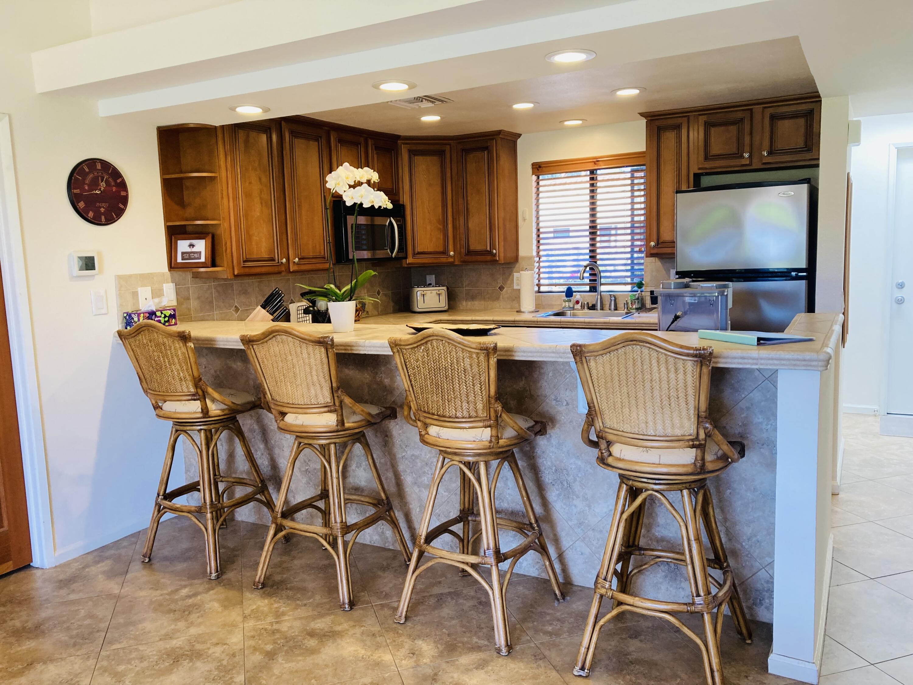 40553 Pebble Beach Circle Palm Desert, CA 92211 - Photo 3 of 22 a view of kitchen with breakfast area