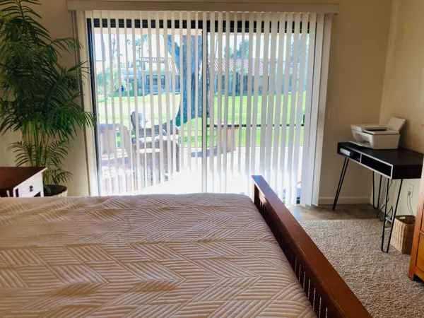 a view of balcony with furniture