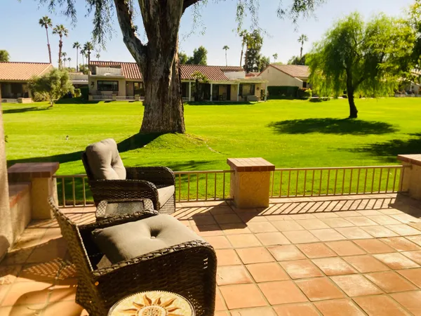 a view of a patio with garden