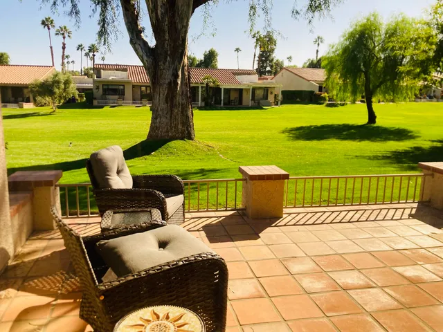 a view of a patio with garden