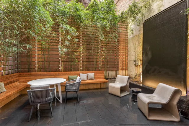 a balcony with furniture and wooden floor