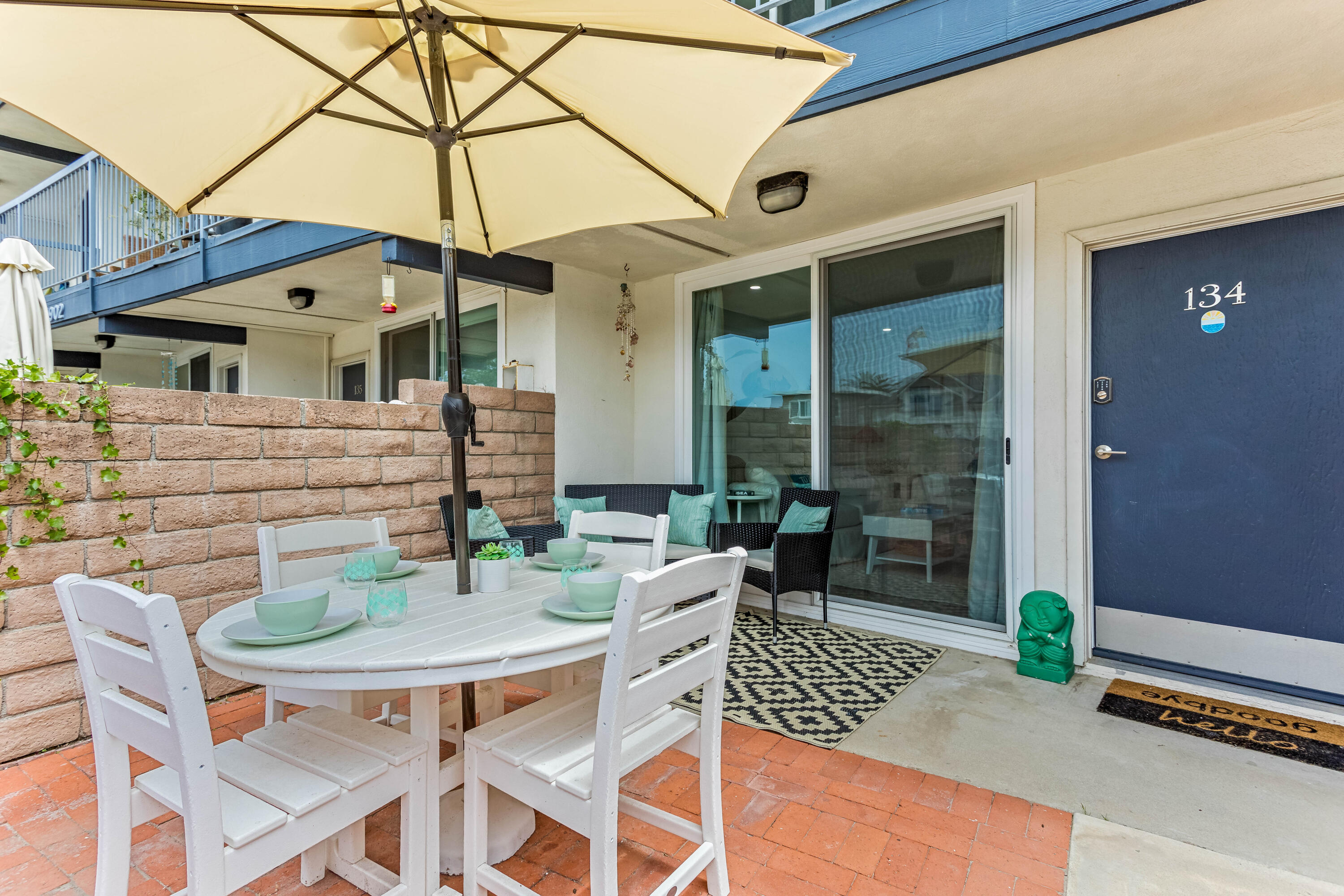4902 Sandyland Road, Unit 134 Carpinteria, CA 93013 - Photo 16 of 19 a view of a patio with a table and chairs
