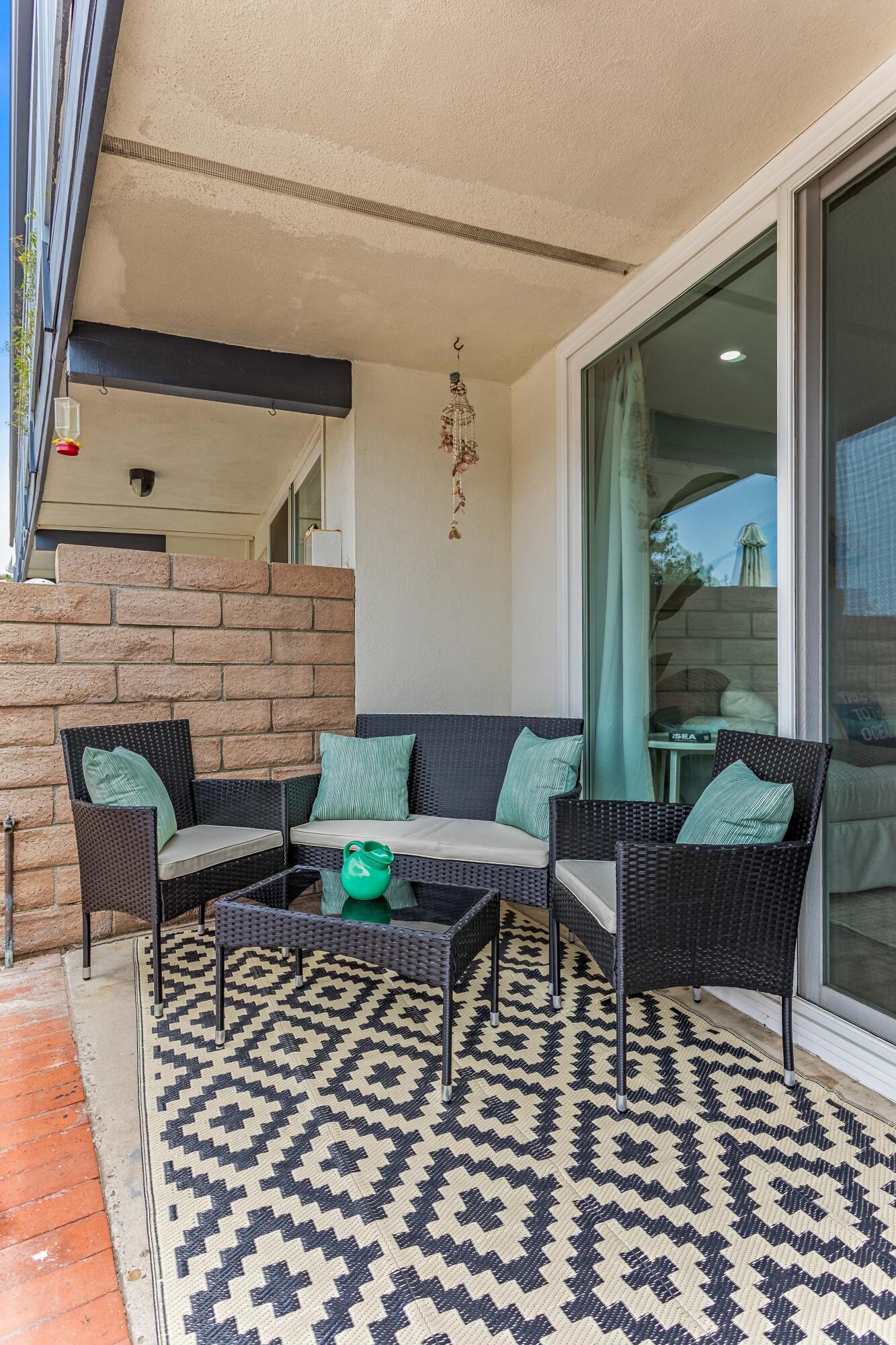 4902 Sandyland Road, Unit 134 Carpinteria, CA 93013 - Photo 17 of 19 a living room with furniture and a fireplace