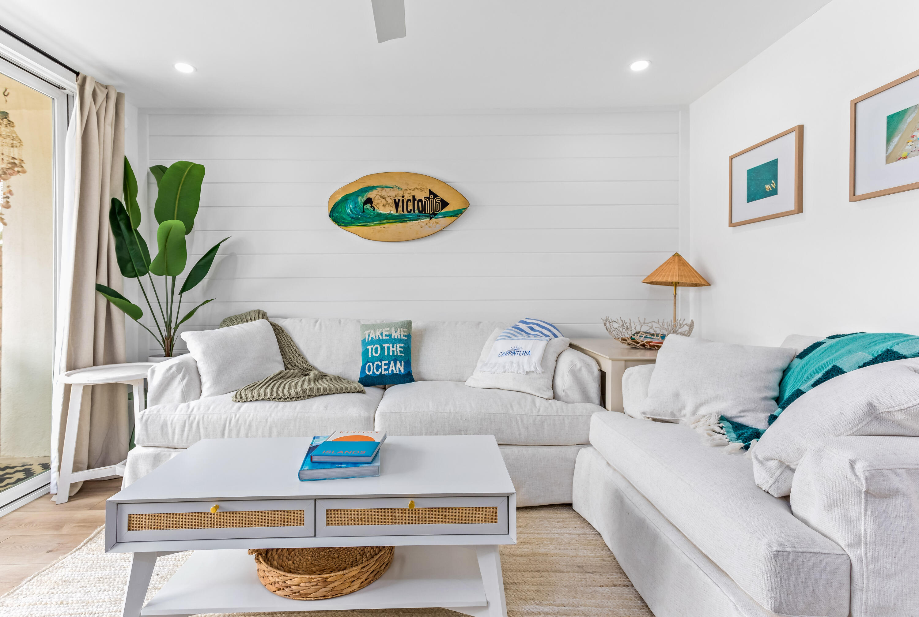 4902 Sandyland Road, Unit 134 Carpinteria, CA 93013 - Photo 2 of 19 a living room with furniture and a potted plant