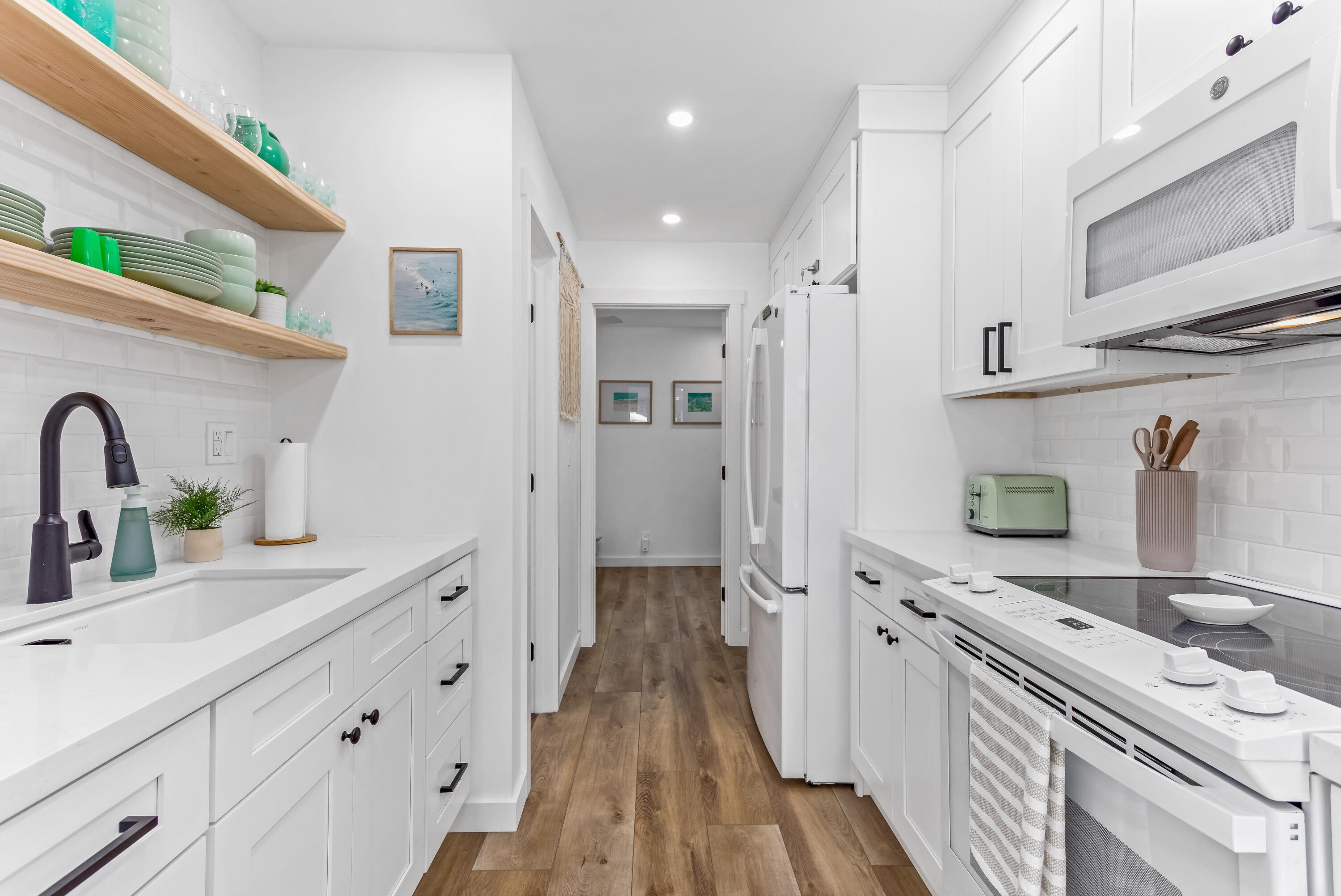4902 Sandyland Road, Unit 134 Carpinteria, CA 93013 - Photo 6 of 19 a kitchen with stainless steel appliances granite countertop a sink stove and refrigerator